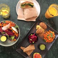Falafel plate, falafel sandwich and kimchi bowl at Hafnia Bar in Copenhagen