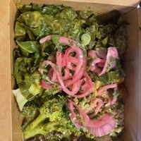 Large bowl takeout box. Build your own with quinoa, black beans, sweet potatoes, broccoli, mushrooms, collard greens, pickled onions, and cilantro lime dressing.  at Revel Kitchen in Brentwood