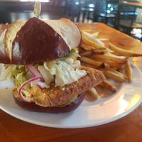 Vegan fried tofu sandwich with fries at Guglhupf in Durham