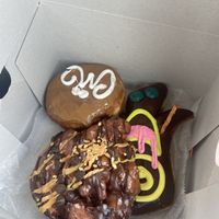 Vegan Maple Cream and VooDoo doll (other one isn’t vegan).  at Voodoo Doughnut - E Colfax in Denver