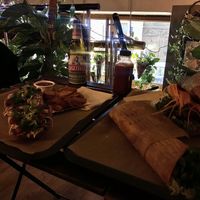 Classic zapienkanka, wedges, vegan gyros wrap and rolnik burger  at Farma Burgerownia Roslinna in Krakow