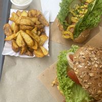 Sloppy farmer burger & soj-dog. Looks good but underwhelmed with flavour.   at Farma Burgerownia Roslinna in Krakow