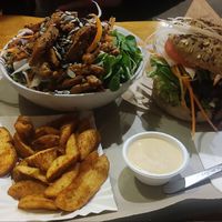 Gyros salad and Bauer burger with fries at Farma Burgerownia Roslinna in Krakow