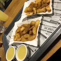 Wedges with cheese sauce  at Farma Burgerownia Roslinna in Krakow