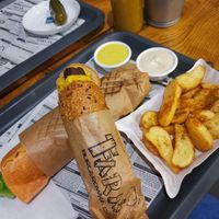Curry sausage and wedges at Farma Burgerownia Roslinna in Krakow