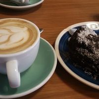 Vegan cappuccino and cake at Pum Pum Cafe in Madrid