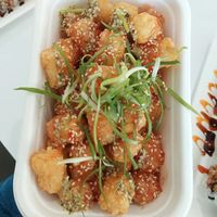 Tots!! They were topped with like a sweet chili sauce. So good!!  at Dharma Sushi & Thai in Boise
