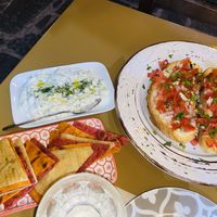 Rhodian pita bread, a vegan tzatziki dip, and bruschetta at ONO in Rhodes