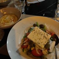 hummus to the right and vegan greek salad  at ONO in Rhodes