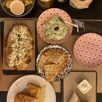 Crunchy potatoes with chunky mayo, Tsatsiki with Pita. Garlic Feta Flatbread, Feta in phyllo pastry, some wrap (I think this one was vegetarian, one of my boyfriends food)  at ONO in Rhodes