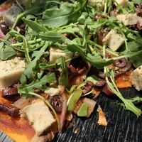 Greek pizza with feta and olives at Veganaki in Athens