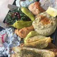 Sharing apetizer plate  at Veganaki in Athens