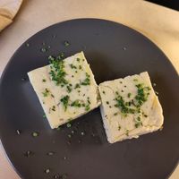 Homemade cashew feta with oil and chives 👌 at Veganaki in Athens