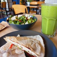 Cheese pockets, gourmet salad and green smoothie. at Veganaki in Athens