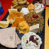 Appetizer platter with loads of sauces, lentils salad, veg Feta cheese, Pita, and hummus (it was huge, basically a full course!) at Veganaki in Athens