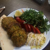 vegan burger with salad, mustard, yoghurt sauce, salad and pita bread  at Veganaki in Athens