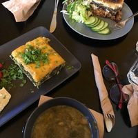 Spinach pie with a slice of delicious vegan cheese and the soup of the day (also spinach). at Veganaki in Athens