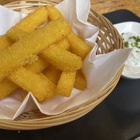 Polenta fries with their really yummy garlic dip! So good   at La Stella Nera in Berlin
