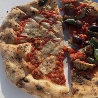 Vegan Margerita + another pizza  at La Stella Nera in Berlin