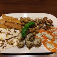 Antipasti with marinated tempeh, artichoke, carrots, tofu, olives. at La Stella Nera in Berlin