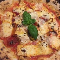 Pizza with vegan cheese, red peppers, smoked tofu, basil at La Stella Nera in Berlin