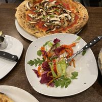 Big salat and Pizza funghi  at La Stella Nera in Berlin