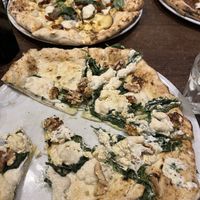 Spinach and walnut pizza (front), Artichoke (back) and diavola (right), all tasted very good. The diavola was actually not THAT spicy.  at La Stella Nera in Berlin