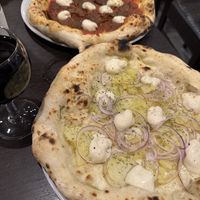 White potato pizza and a seitan-based pizza diavola.  at La Stella Nera in Berlin