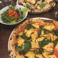 Delicious pizzas and salad from La Stella Nera at La Stella Nera in Berlin