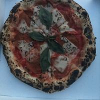 salame pizza rossa: tomato sauce, vegan cheese, vegan salami, fresh basil at La Stella Nera in Berlin