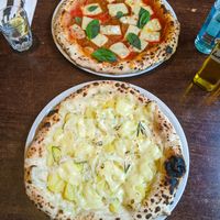 Patate e Cipolle pizza and Salame pizza at La Stella Nera at La Stella Nera in Berlin