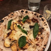 Pizza with vegan cheese and spicy tofu  at La Stella Nera in Berlin