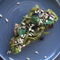 Toast with a green spread and sautéed vegetable at Joe's Place in Pico