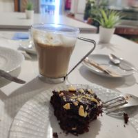 Coffee with soy milk and cake, great combo at Veganeats Caffe in Lisbon