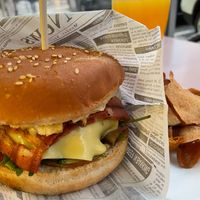 Beyond burger with an egg and orange juice. at Veganeats Caffe in Lisbon