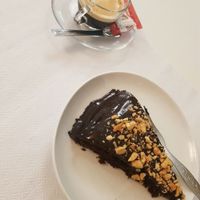 Chocolate cake and Coffee   at Veganeats Caffe in Lisbon