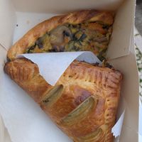 Vegan tuna pastry and quiche underneath at Veganeats Caffe in Lisbon