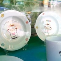 Happy cows at the entrance at Veganeats Caffe in Lisbon