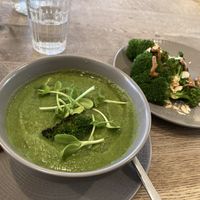 Green soup with side of charred broccoli   at Farmacy in West London