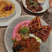 Falafel waffles with aubergine sambal, beetroot hummus & cucumber yoghurt raita at Farmacy in West London