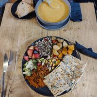 Spinache and onion flatbread meal with salad next to the soup at Organico in Epsom