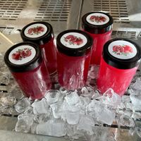 Ready to buy plain fresh pomegranate juice in their store   at Novagea Juice Corner in Athens