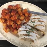 Breakfast burrito and tots with salt, pepper, ketchup and hot sauce   at The Tasty in Philadelphia