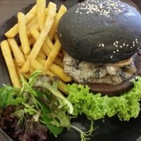Swiss mushroom charcoal burger  at GroVe in Central Singapore