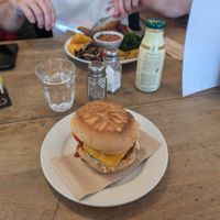 Breakfast bap/bun and large breakfast behind at Cafe Kino in Bristol
