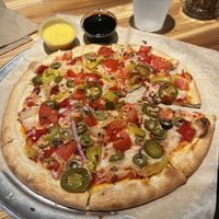 Jalapeño, banana pepper, red onion, green olive, and tomatoes. With balsamic glaze and garlic “butter” for dippingg  at Dells Pizza Lab in Wisconsin Dells