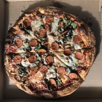 Vegan Pepperoni and cheese with spinach and garlic  at Homeslyce Pizza Bar in Columbia