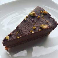 chocolate and chaga cake sprinkled with pistachios  at Juice Warrior in Edinburgh