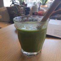 Great tropical smoothie with bamboo straw at Oogst in Alkmaar