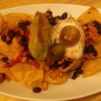 Totopos con frijoles negros, guacamole y crema agria at La Huella Vegana in Rivas-vaciamadrid